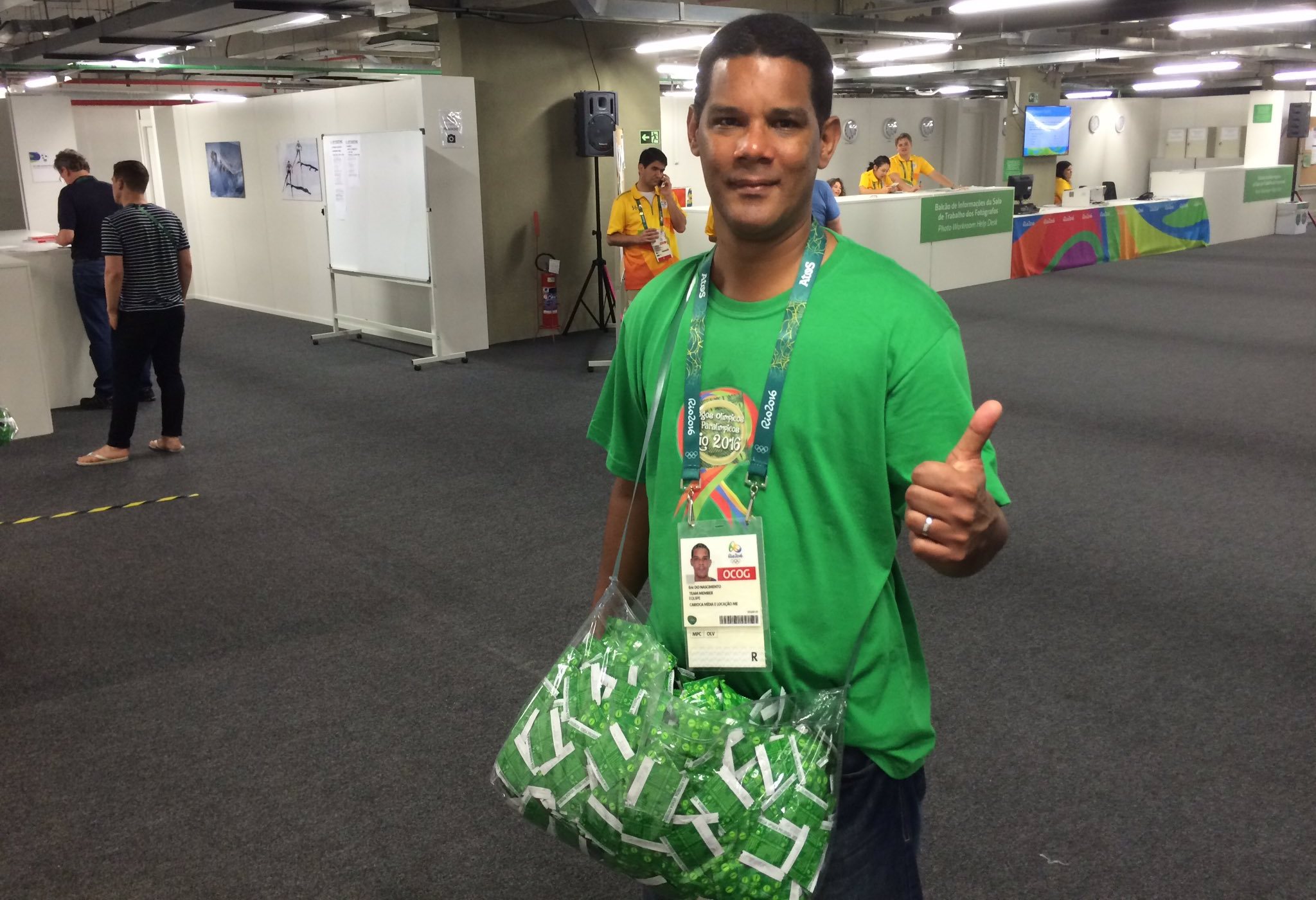 Meet Eric, the guy whose job it is to walk around the Olympics with a big sack of condoms