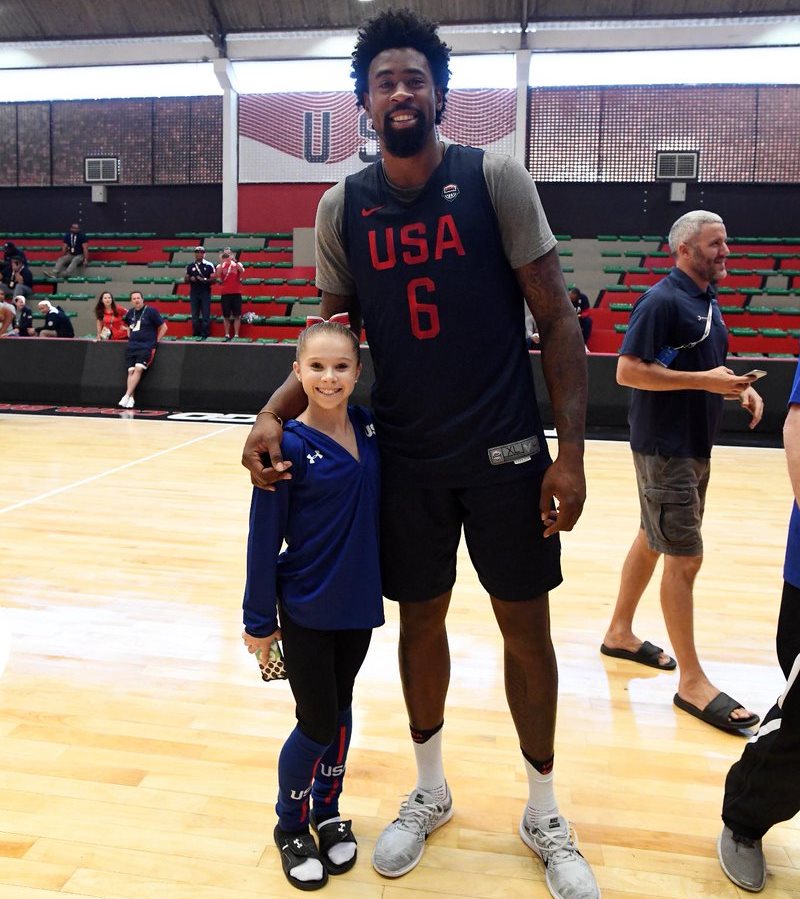 Ragan Smith of U.S. women's gymnastics team poses with DeAndre Jordan.