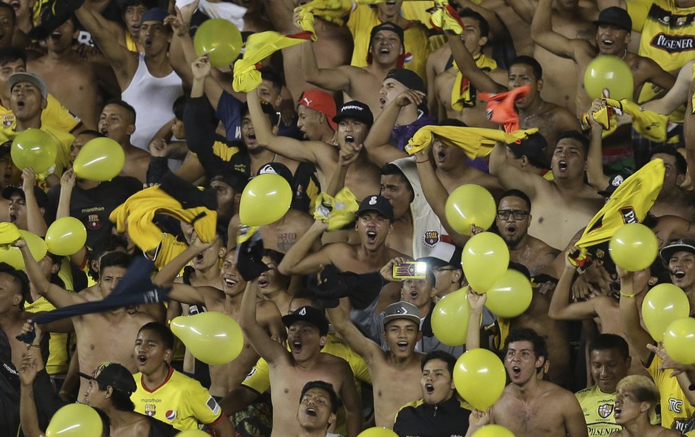 Ecuador’s Barcelona cheer before the start of a Copa Libertadores football match against Colombia’s Atlético Nacional