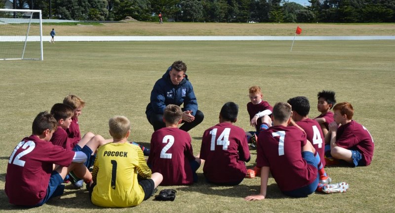 Kane coaching a Sacred Heart College junior side at the AIMS Games