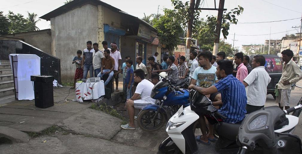 Indian cricket fans watch a broadcast of the final in Gauhati