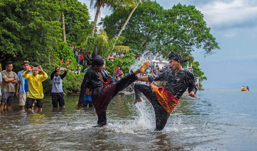 People take part in Silat, a traditional martial art west Sumatra